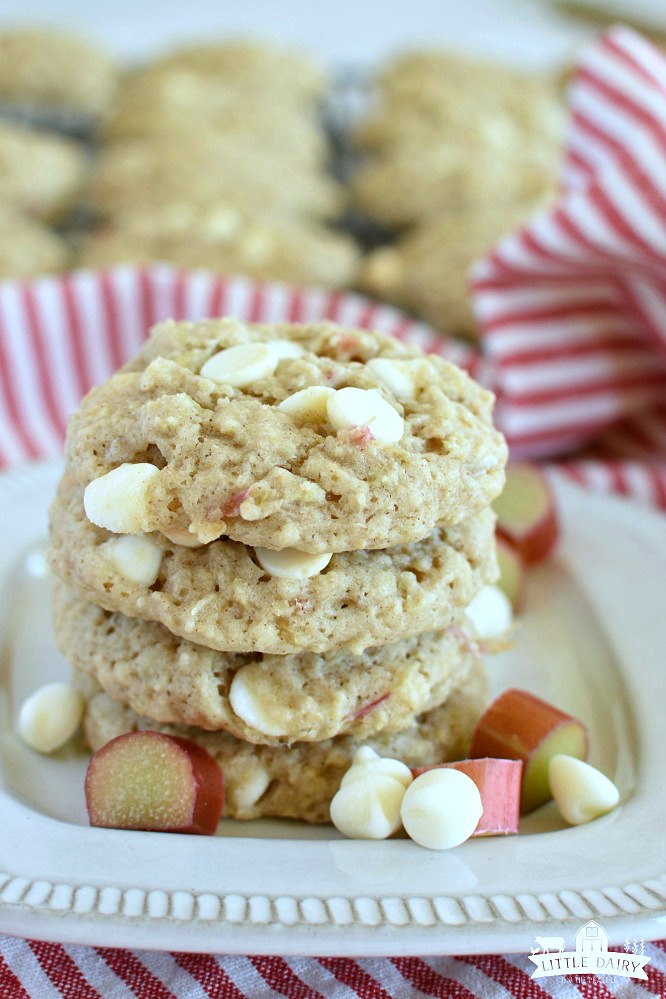 A stack of rhubarb cookies on a white plate, and a red and white napkin in the background