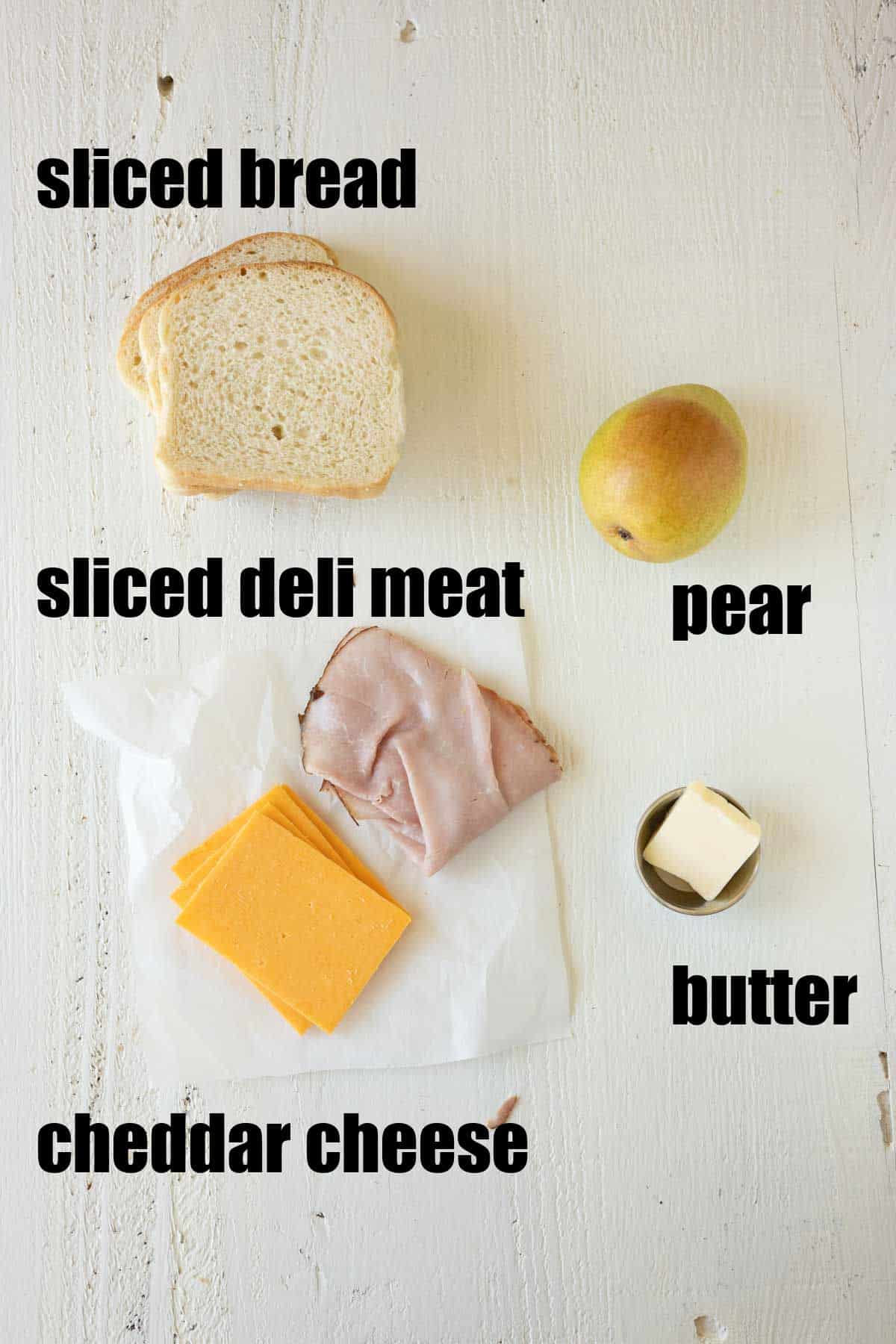Ingredients needed to make a grilled cheese sandwich with pears.