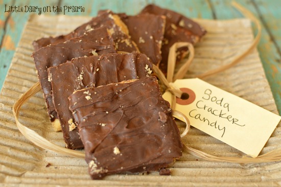 cracker candy covered with chocolate chips on a cardboard paper with a gift tag