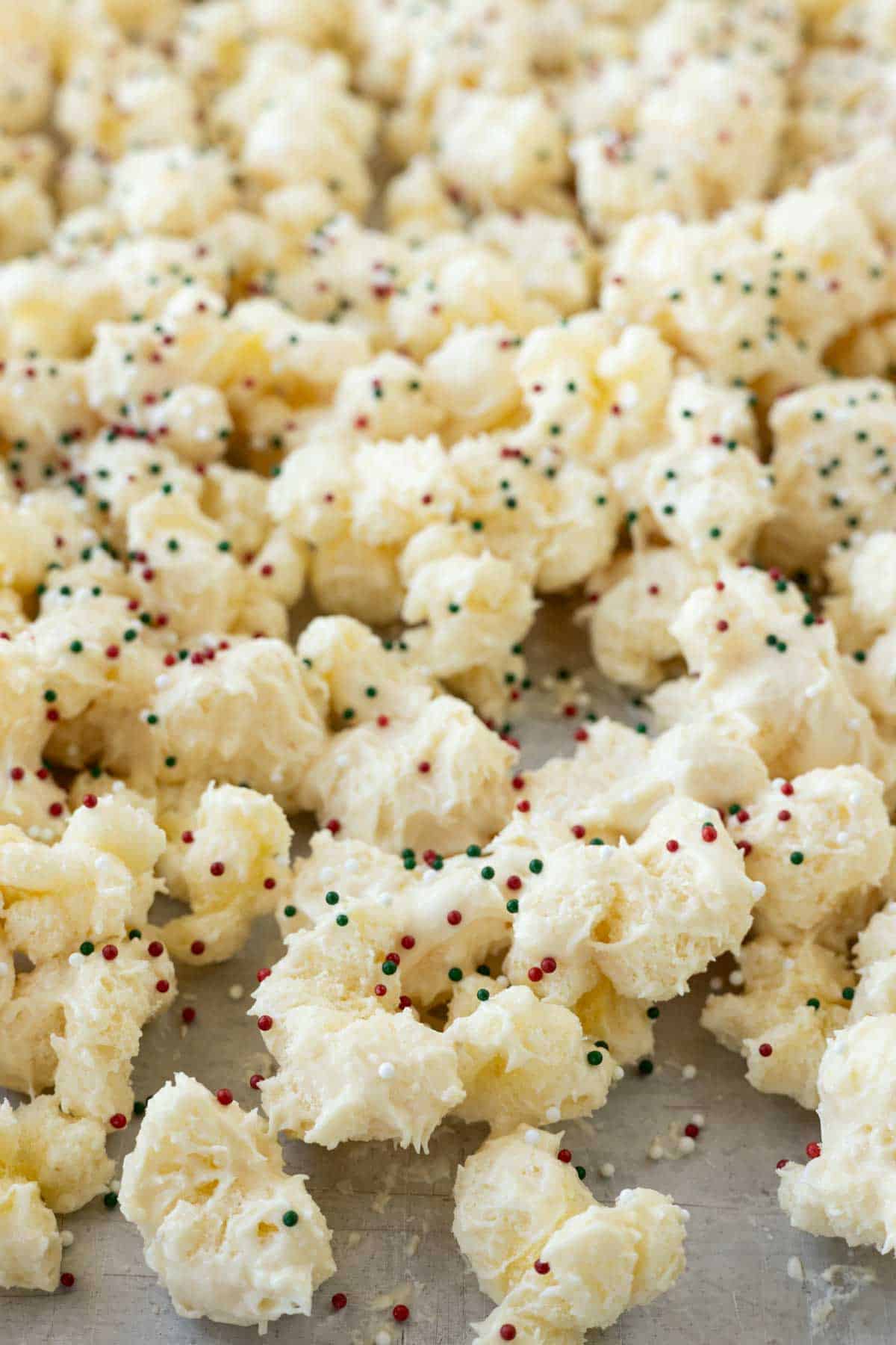 White chocolate coated puff corn with Christmas sprinkles.
