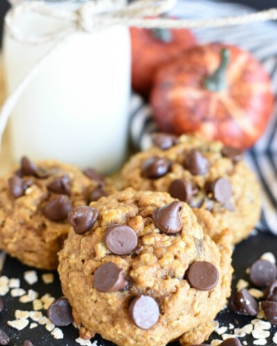 Pumpkin Oatmeal Chocolate Chip Cookies are super soft cookies made with pumpkin puree, oatmeal, flour, chocolate chips, and all the traditional pumpkin spices! pitchforkfoodie.com #cookies #chocolate #pumpkin #oatmealcookies #chocolatechipcookies #dessert #baking #treats #snacks #recipe