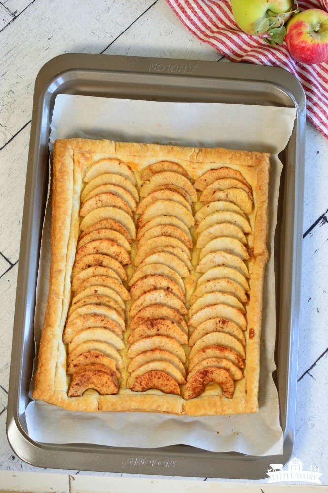 Simple Puff Pastry Apple Tart has sliced apples, tossed in a sugar mixture, placed on top of a puff pastry. It's and easy dessert! pitchforkfoodie.com