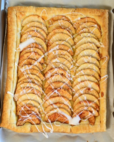 Simple Puff Pastry Apple Tart has sliced apples, tossed in a sugar mixture, placed on top of a puff pastry. It's and easy dessert! pitchforkfoodie.com #desserts #baking #dessert #apples #pie #fall #puffpastry #easyrecipe #recipe #yummy