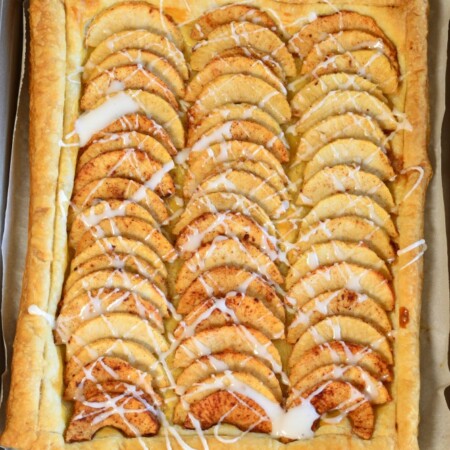 Simple Puff Pastry Apple Tart has sliced apples, tossed in a sugar mixture, placed on top of a puff pastry. It's and easy dessert! pitchforkfoodie.com #desserts #baking #dessert #apples #pie #fall #puffpastry #easyrecipe #recipe #yummy