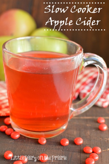 Slow Cooker Apple Cider gets it's gorgeous color and yummy flavor from red hot candies. This is so simple to make! Little Dairy on the Prairie