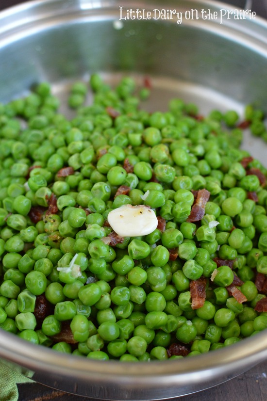 You will never think of peas the same way again! Butter, bacon, garlic and Parmesan give green peas a whole new makeover!