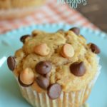 a peanut butter muffin with chocolate chips and peanut butter chips on top