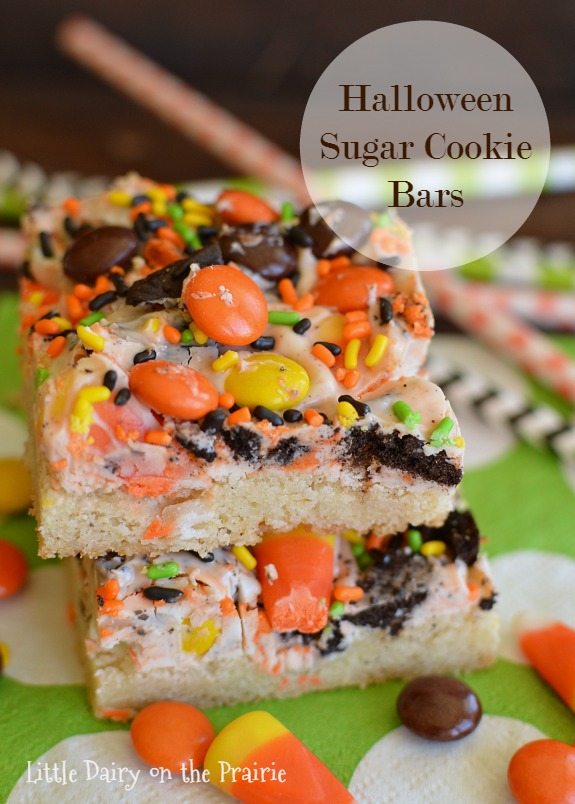 These Halloween Sugar Cookie bars are so much quicker than rolling out sugar cookies, and they are LOADED with Halloween candy! Little Dairy on the Prairie