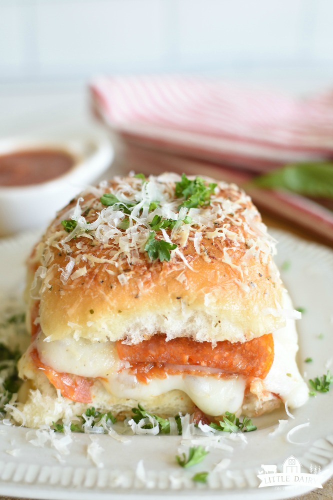 A pepperoni pizza slider on a white plate