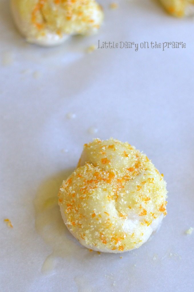 raw orange knots sprinkled with orange sugar