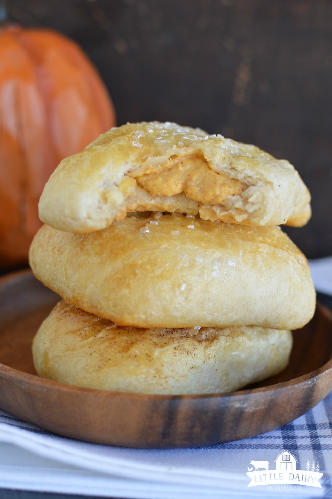 pieces of dough filled with pumpkin cream filling, a stack of three
