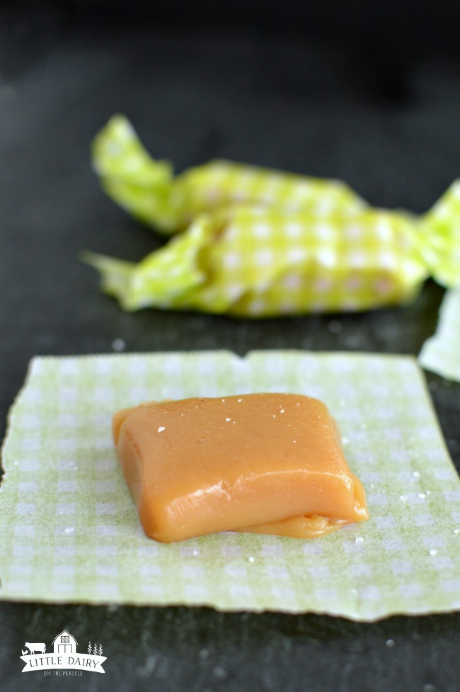 A caramel on a green and white gingham paper