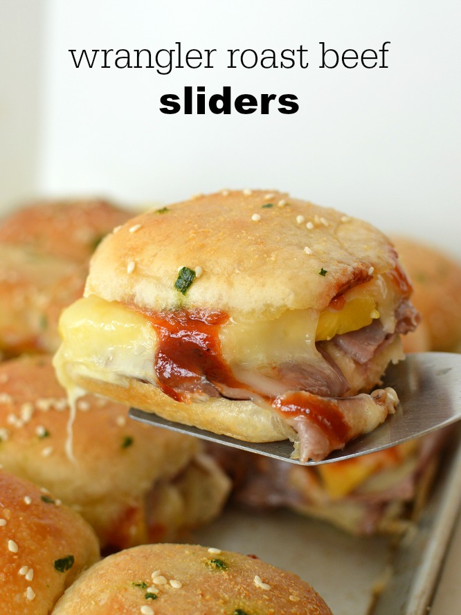 a slider made with roast beef and barbecue sauce on a spatula plus text  Wrangler Roast Crimson meat Sliders Wrangler Roast Beef Sliders cheesy meaty and yummy