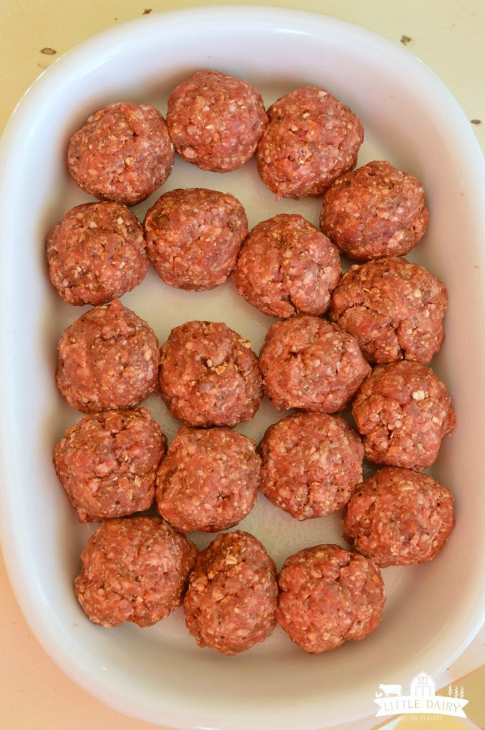 raw meatballs in a baking dish