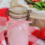 pink strawberry salad dressing in a jar