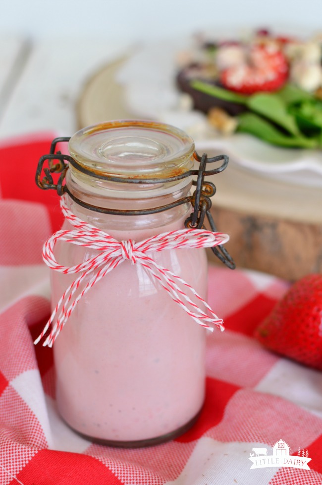 pink strawberry salad dressing in a jar