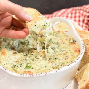 cream cheese dip with broccoli on a piece of croustini