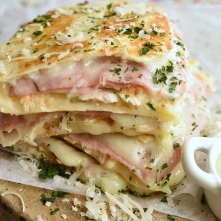 wedges of golden brown quesadillas with deli ham, diced chicken, and melted swiss cheese