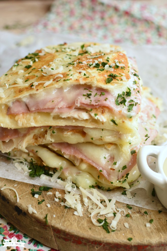 wedges of golden brown quesadillas with deli ham, diced chicken, and melted swiss cheese