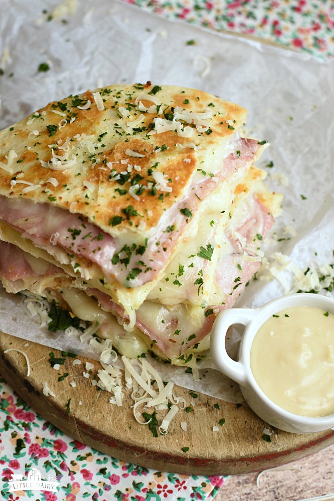 wedges of golden brown quesadillas with deli ham, diced chicken, and melted swiss cheese