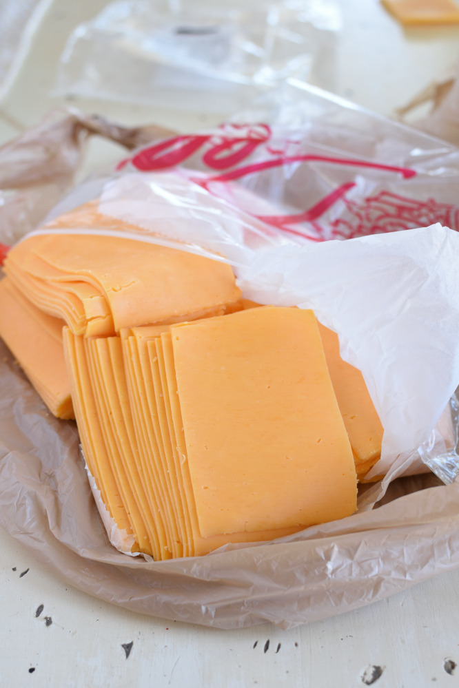Sliced Yellow Cheddar Cheese in a deli bag