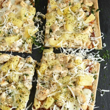 square pizza with pineapple and parmesan cheese