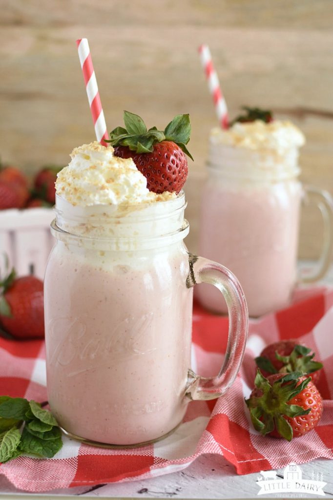 Strawberry Smoothie in a mason jar with a straw