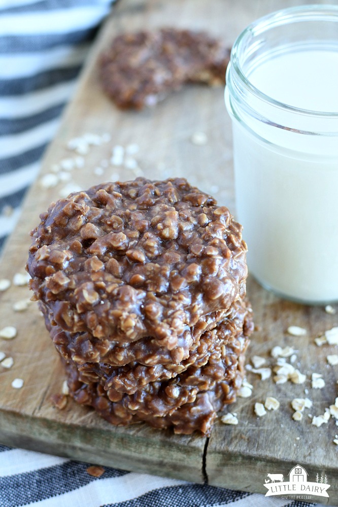 a stack of no bake cookies, a jar of milk