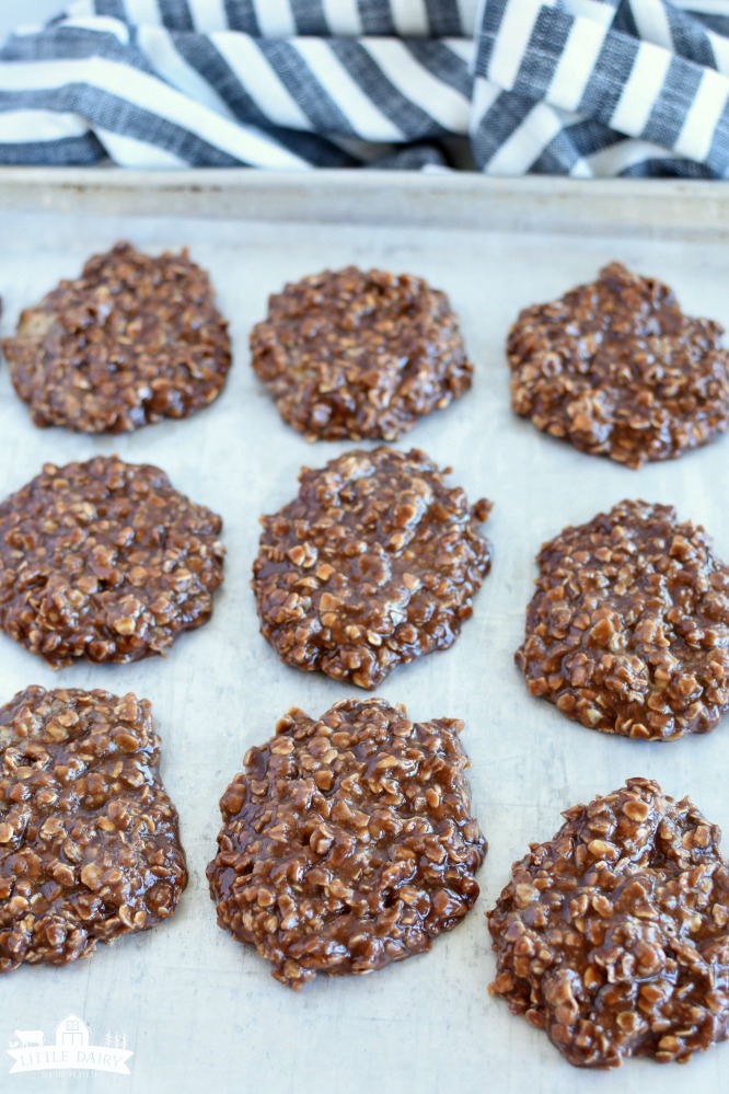 a cookie sheet with no bake chocolate oatmeal cookies dropped on it