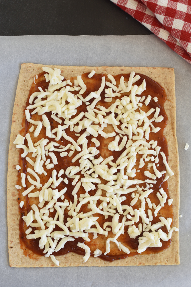 flat bread pizza with barbecue sauce and cheese