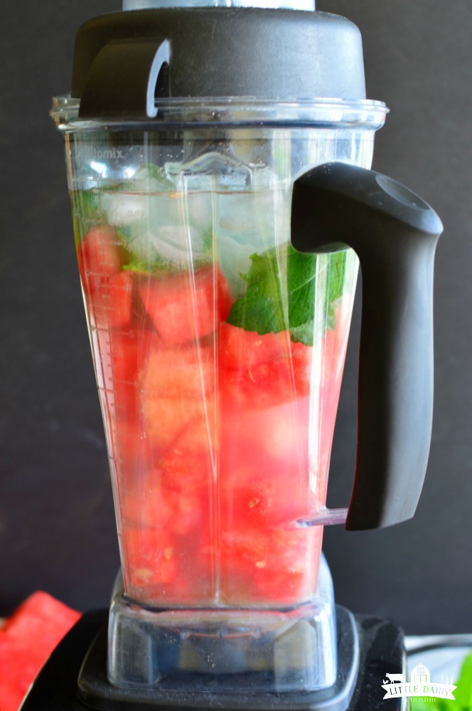 Blender with watermelon cubes, ice, and lemonade