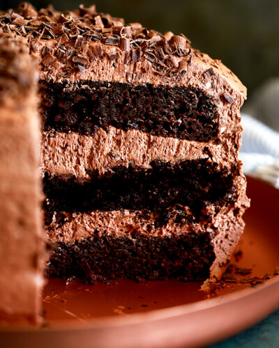 triple layer chocolate cake on a platter