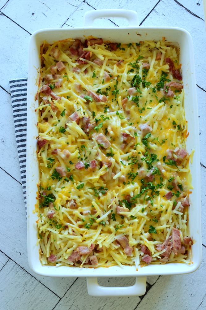 Make Ahead Hash Brown Breakfast Casserole has diced ham, cheese, and eggs. Assemble it, let it sit overnight, and bake it in the morning. pitchforkfoodie.com #breakfast #casserole #Christmasmorning #brunch #christmasbreakfast #makeahead #overnightbreakfast #ham #cheese #hashbrowns #potatocasserole #potatoes