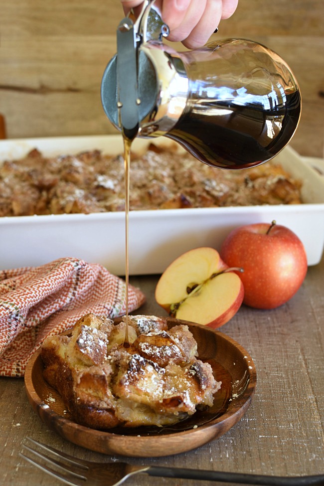 maple syrup drizzled on baked apple pie french toast casserole