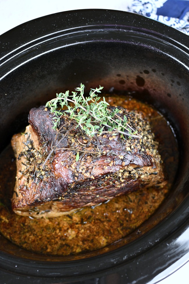 cooked roast beef in a slow cooker