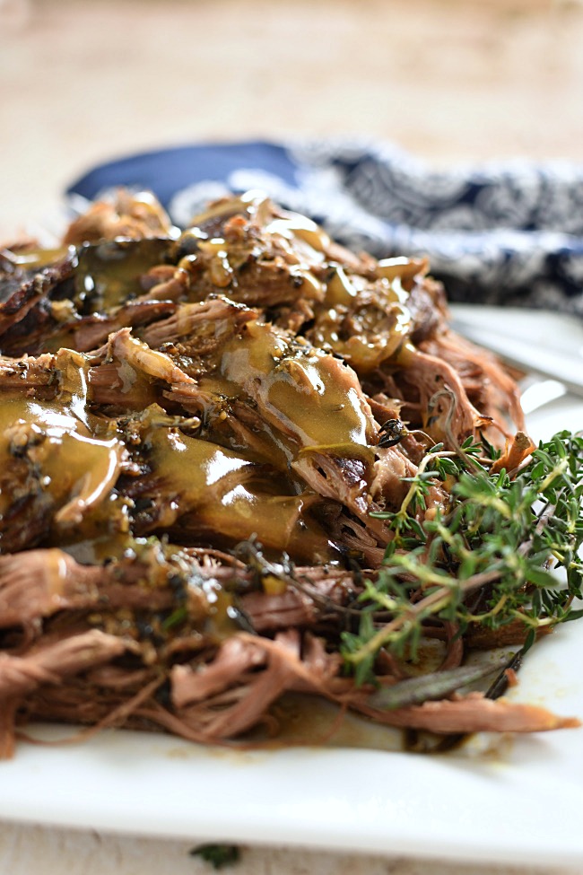 shredded roast beef and gravy on a plate