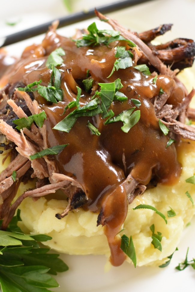 mashed potatoes and shredded roast beef with chopped parsley