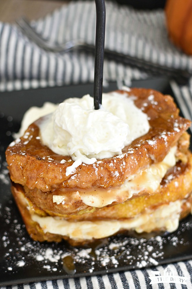 Cream cheese stuffed French toast with whipped cream