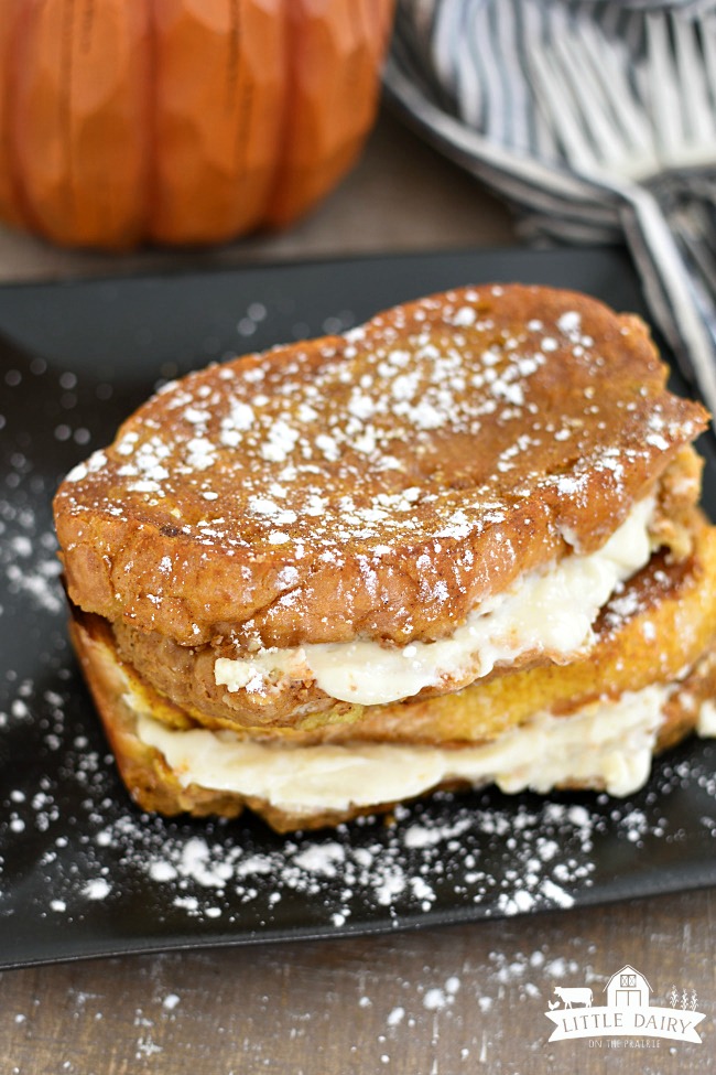 cream cheese stuffed french toast with powdered sugar sprinkled on top