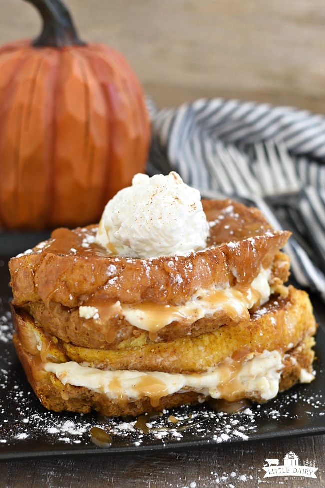 cream cheese stuffed french toast with whipped cream and caramel sauce