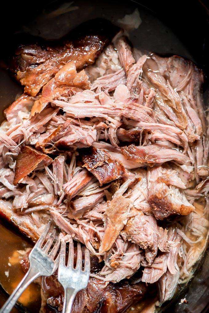 a pot with cooked and shredded pork