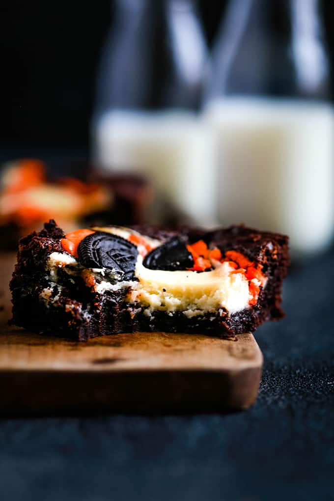 bar cookie with oreo crumb crust and topped with cheesecake and orange filled oreo crumbs