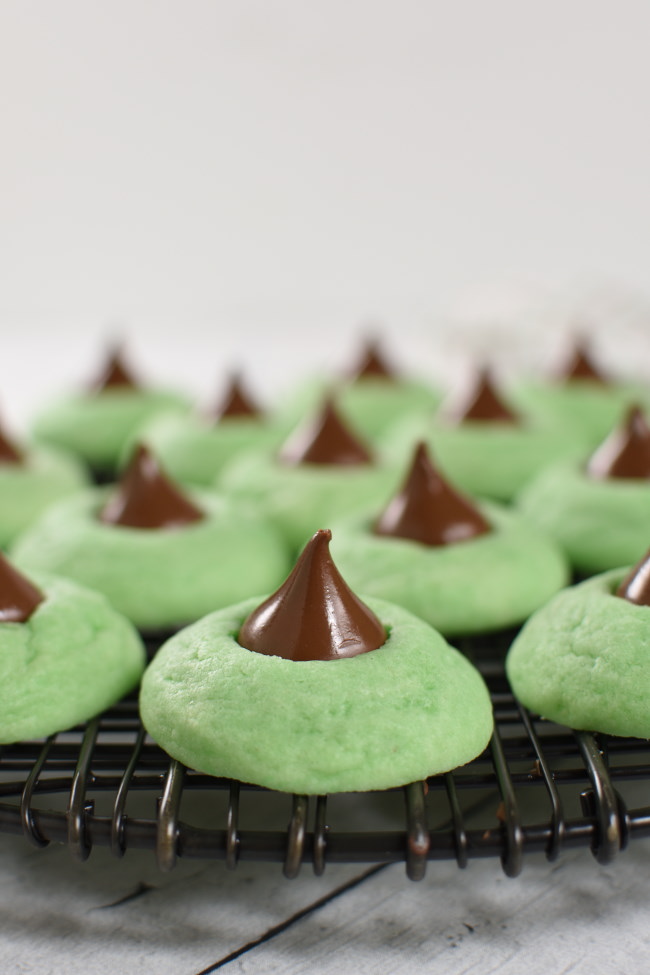 mint kiss cookies on a cooling rack