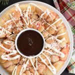 baked peppermint bark monkey bread with chocolate sauce