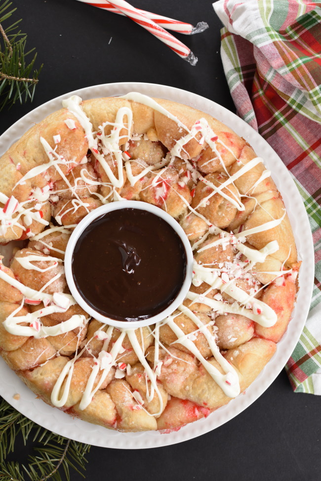 baked peppermint bark monkey bread with chocolate sauce