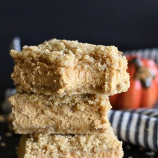 Pumpkin Cheesecake Crumb Bars stacked on each other