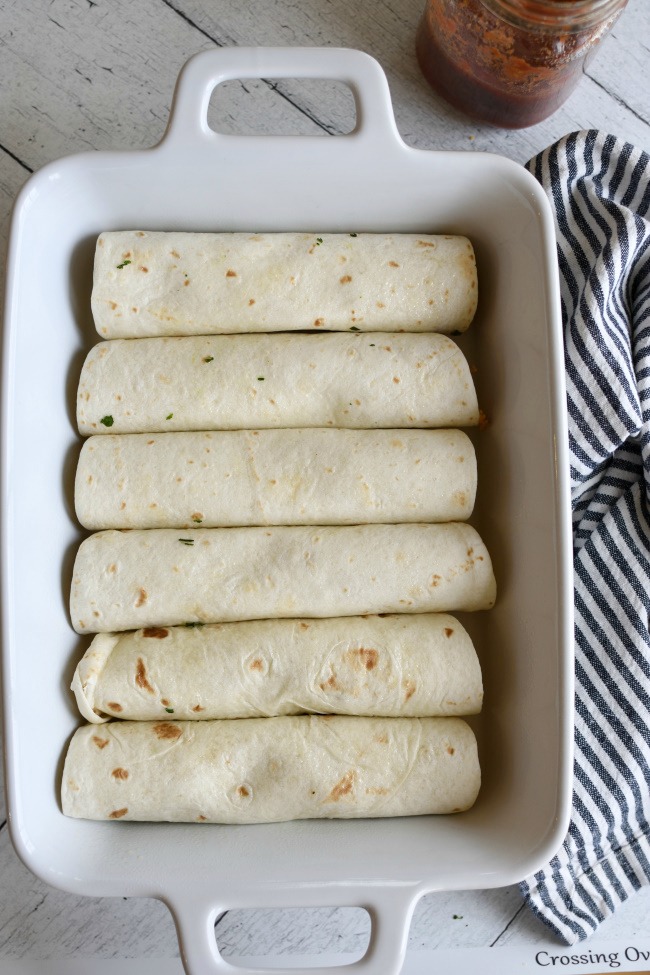 Rolled burritos in a baking dish