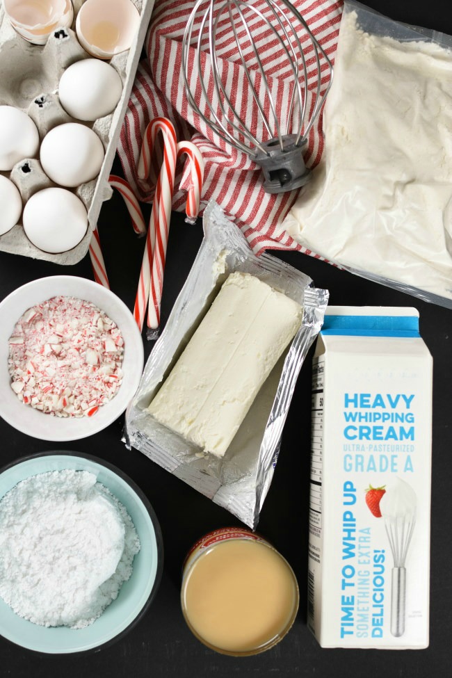 ingredients needed to make peppermint poke cake on a black background