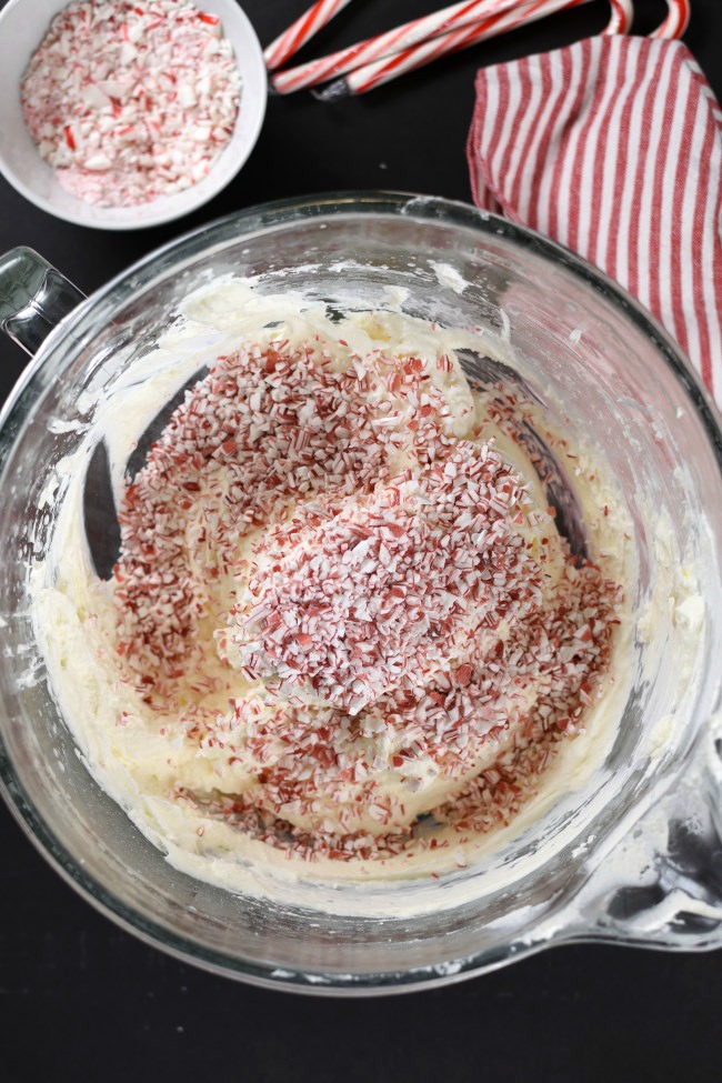 A bowl with whipped cream and crushed candy canes