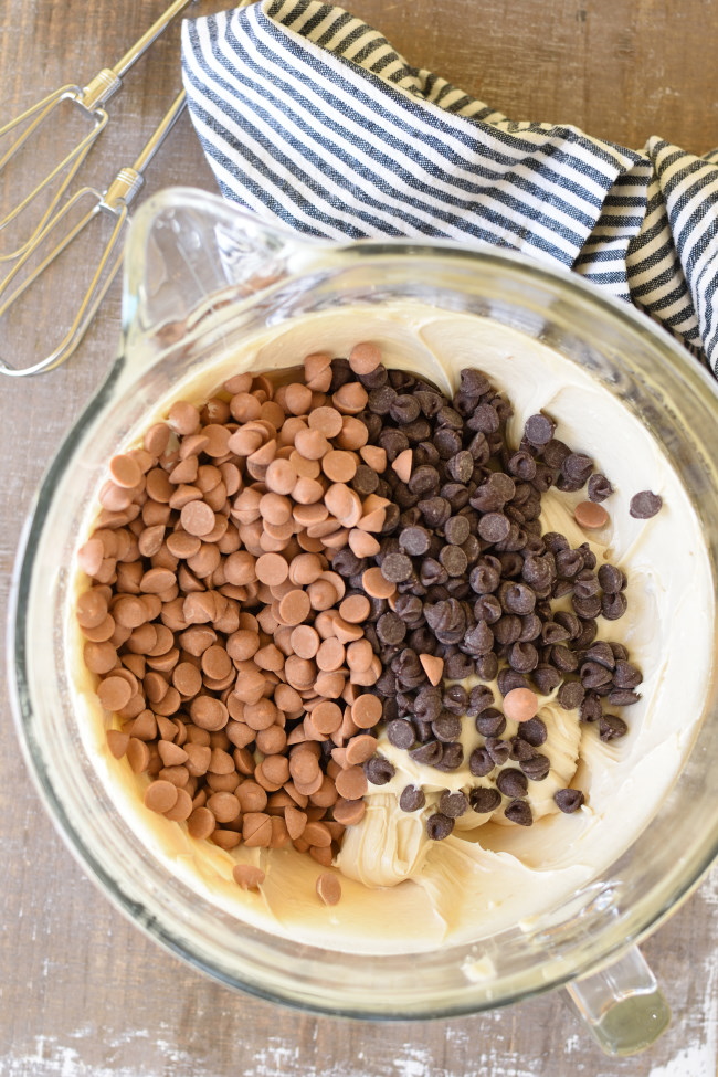 a mixing bowl butterscotch and chocolate chips on cookie dough